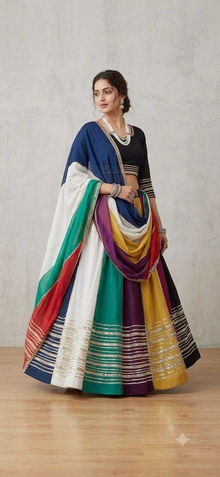 Woman in a multicolour striped lehenga with a navy and black blouse